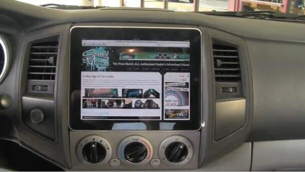 iPad plugged into a car dashboard